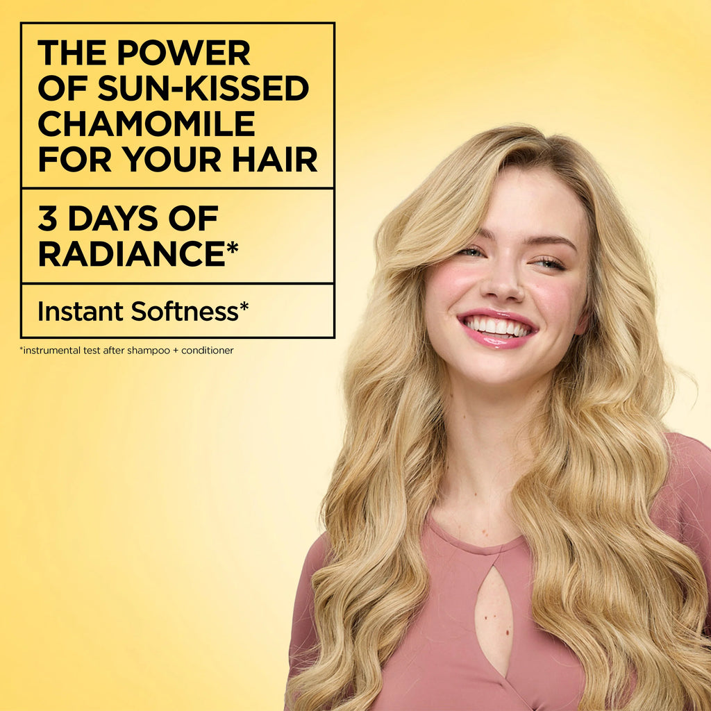 Garnier Ultra Doux Camomile and Flower Honey illuminating shampoo bottle with the product label visible.