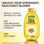Garnier Ultra Doux Camomile and Flower Honey illuminating shampoo bottle with natural ingredients and floral design.