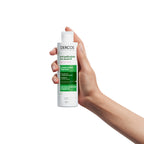 Vichy Dercos Anti-Dandruff Sensitive Shampoo in a white bottle with blue cap, designed for delicate scalp care.