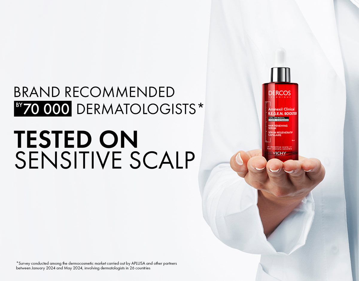 Vichy Dercos Aminexil Clinical Booster bottle with applicator brush for hair treatment and scalp care.