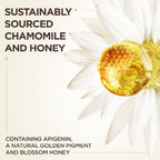 Garnier Ultra Doux Camomile and Flower Honey illuminating shampoo bottle with chamomile flowers and honey in background
