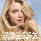 Garnier Ultra Doux Camomile and Flower Honey Illuminating Shampoo bottle with fresh chamomile flowers, casual hair care look