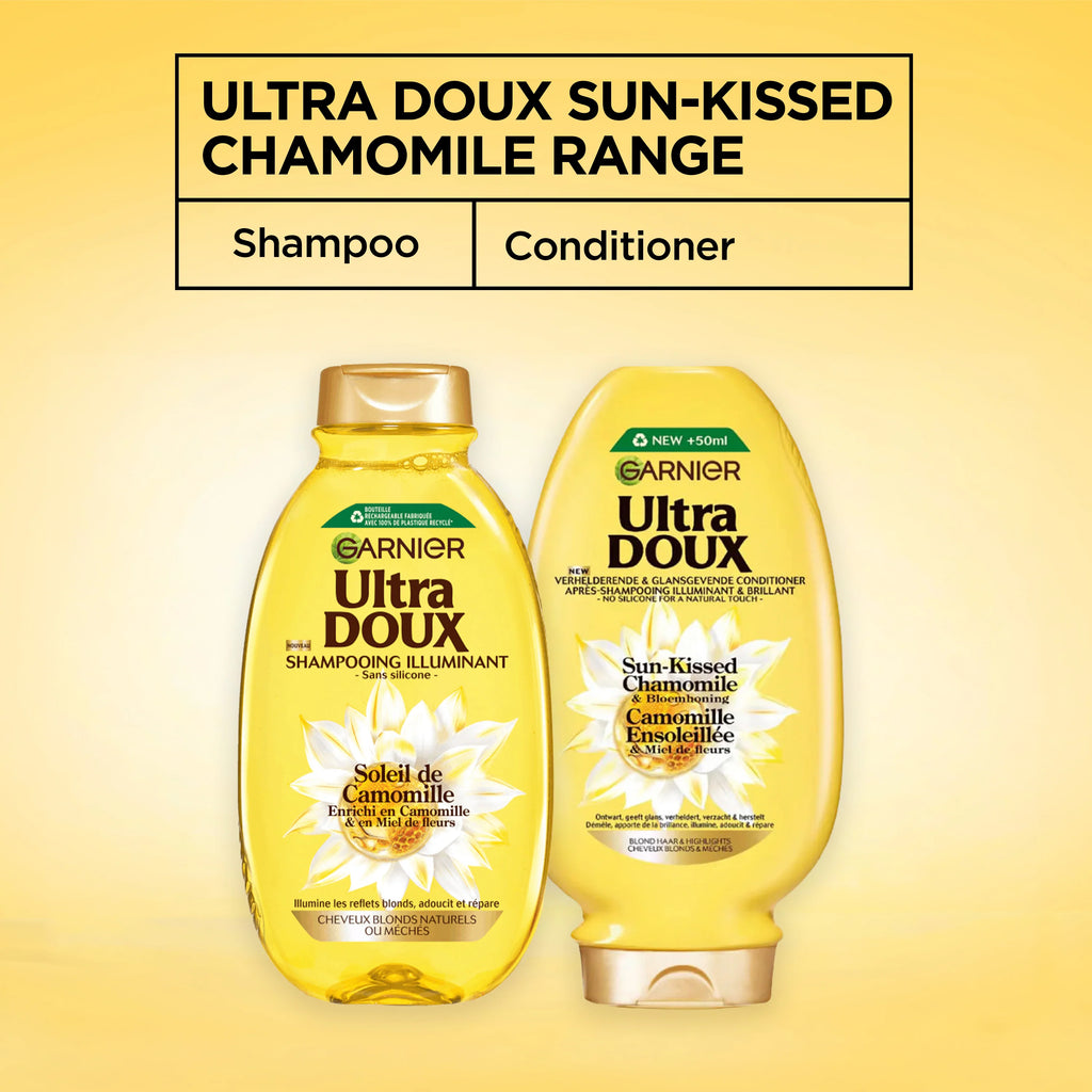 Garnier Ultra Doux Camomile and Flower Honey illuminating shampoo bottle for casual hair care, with a white and yellow design.