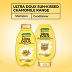 Garnier Ultra Doux Camomile and Flower Honey illuminating shampoo bottle for casual hair care, with a white and yellow design.