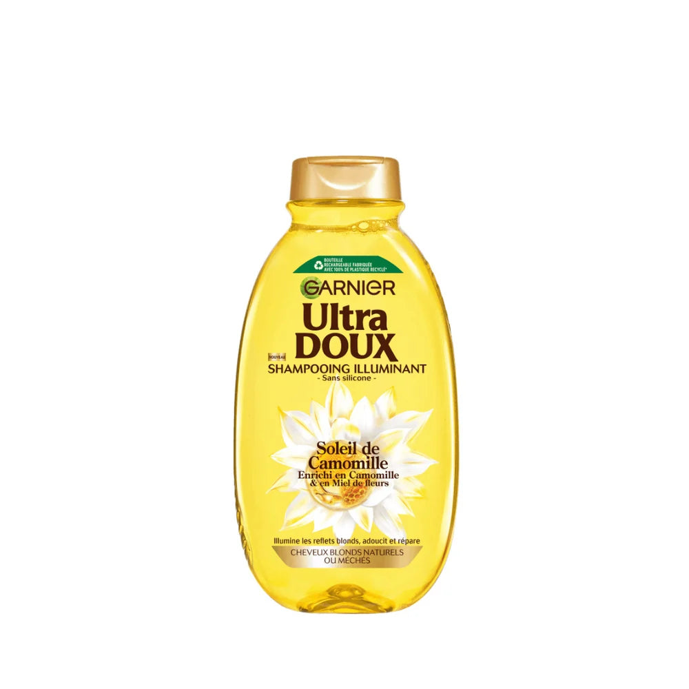 Garnier Ultra Doux camomile and flower honey illuminating shampoo bottle with a clean, natural hair care design.