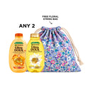 Two Garnier shampoos bottles with colorful labels, showcasing different variants for hair care.