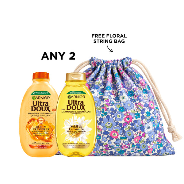 Two Garnier shampoos bottles with colorful labels, showcasing different variants for hair care.