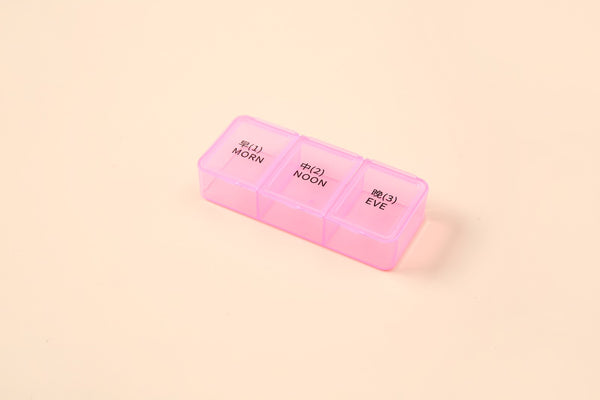 AB Care Mini Cube 3 Pocket Pill Box showing compact, multi-compartment design for medication storage in a parapharmacy setting.