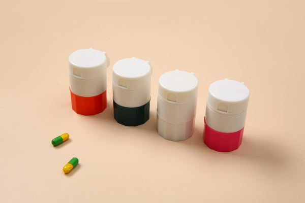 AB Care Pill Vault pill cutter and crusher in black, compact parapharmacy device for safe medication splitting and crushing.