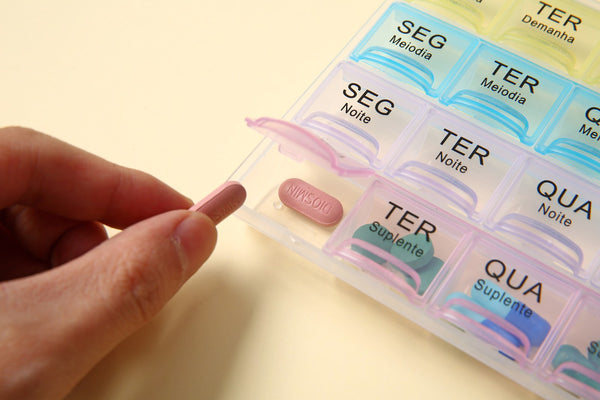 AB Care Twin Week 14 AM/PM weekly pill organizer with 14 compartments for daily medication management.