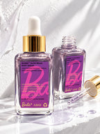 Two bottles of ADAY x Barbie Glow Beam Body Serum, one open with its dropper alongside