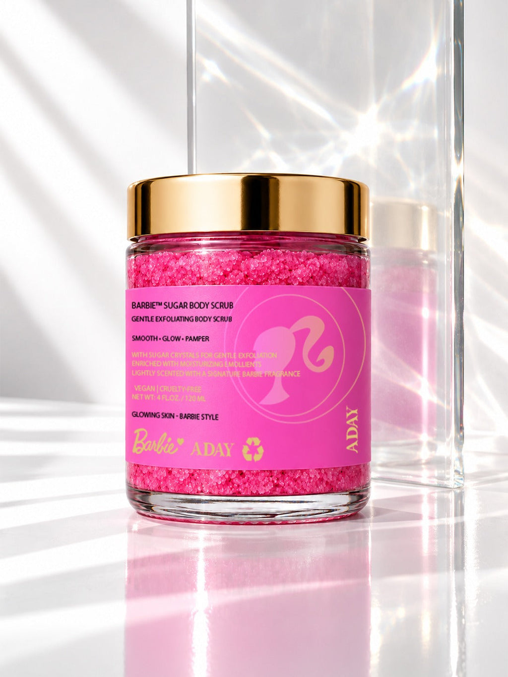 The ADAY x Barbie Sugar Body Scrub jar in soft daylight