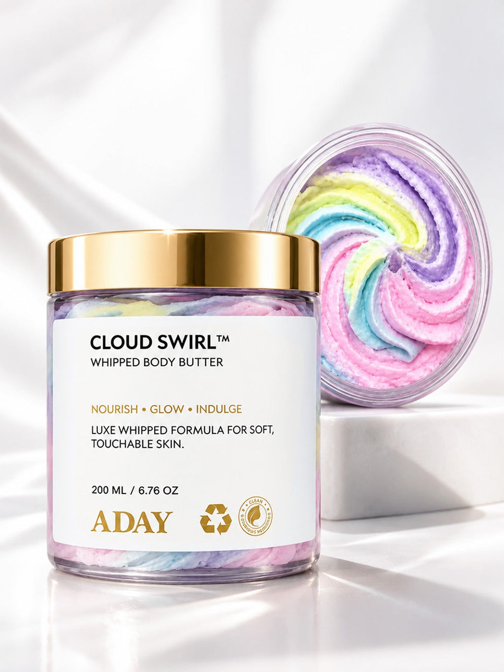 Closed jar of ADAY Cloud Swirl Whipped Body Butter with a swirl of the butter behind it