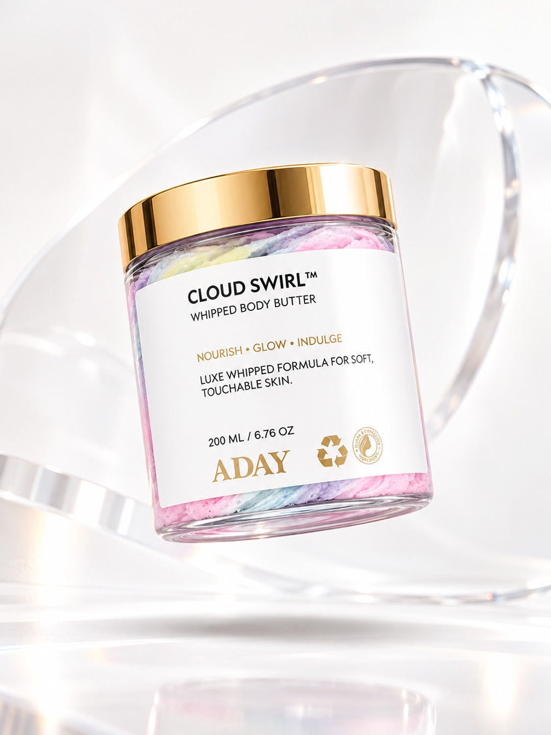 ADAY Cloud Swirl Whipped Body Butter on a sunlit surface with a clear acrylic arc behind it