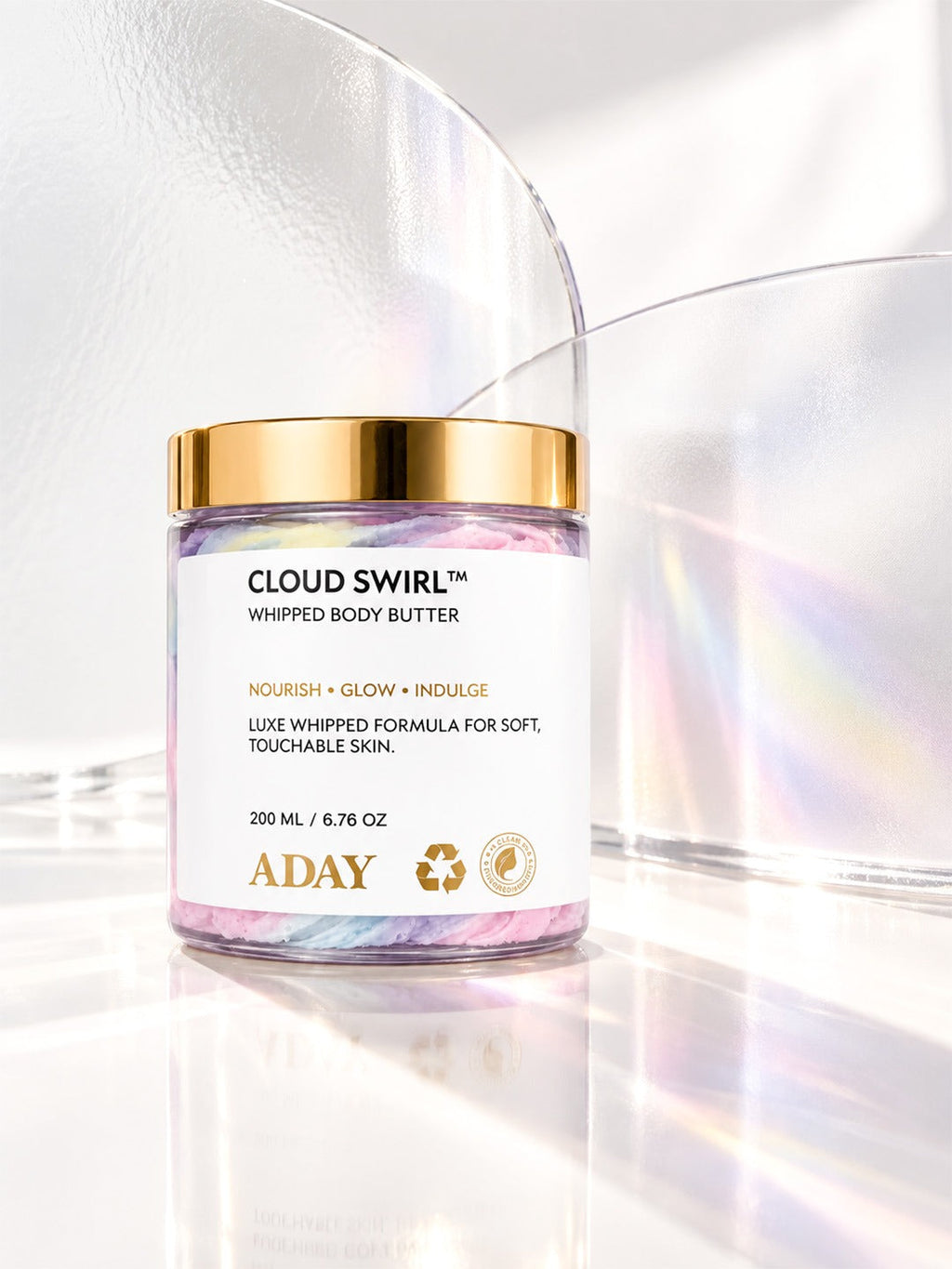 ADAY Cloud Swirl Whipped Body Butter against an iridescent backdrop