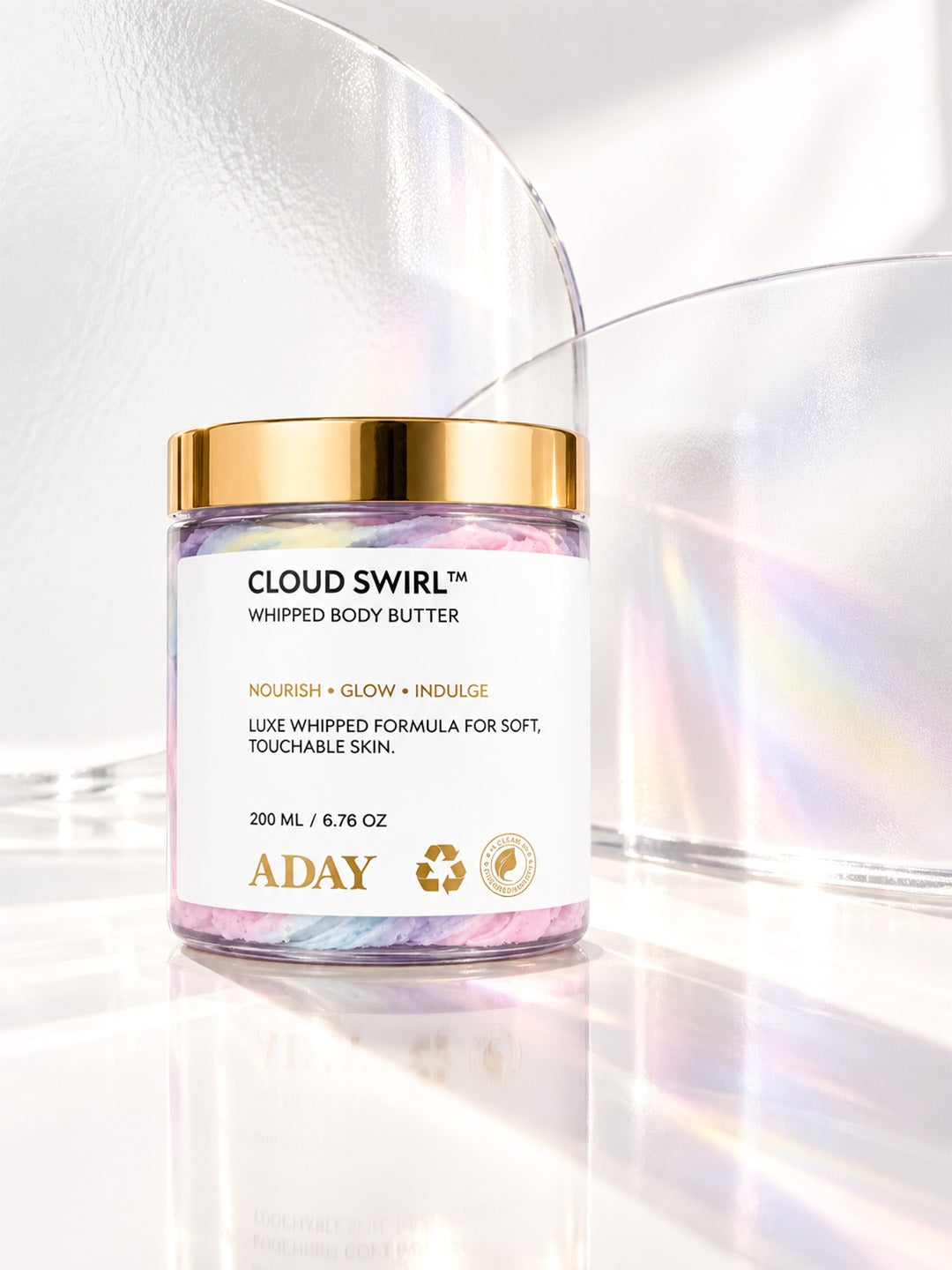 ADAY Cloud Swirl Whipped Body Butter against an iridescent backdrop