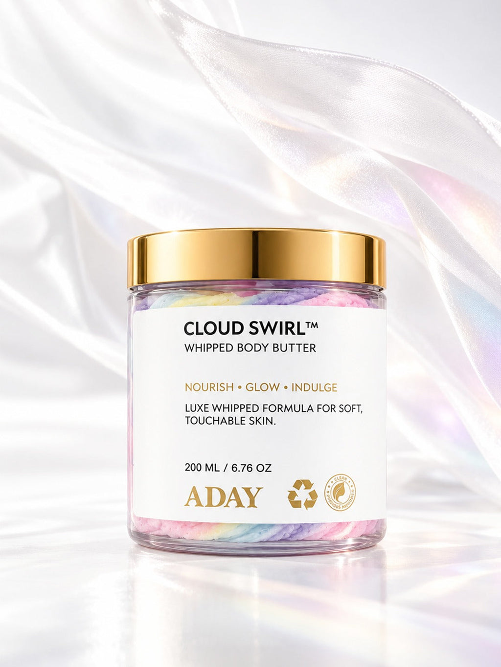 ADAY Cloud Swirl Whipped Body Butter with flowing silk behind it
