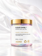 ADAY Cloud Swirl Whipped Body Butter with flowing silk behind it