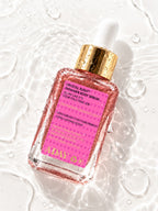 ADAY Crystal Rush Shimmer Body Serum lying in shallow water, seen from above