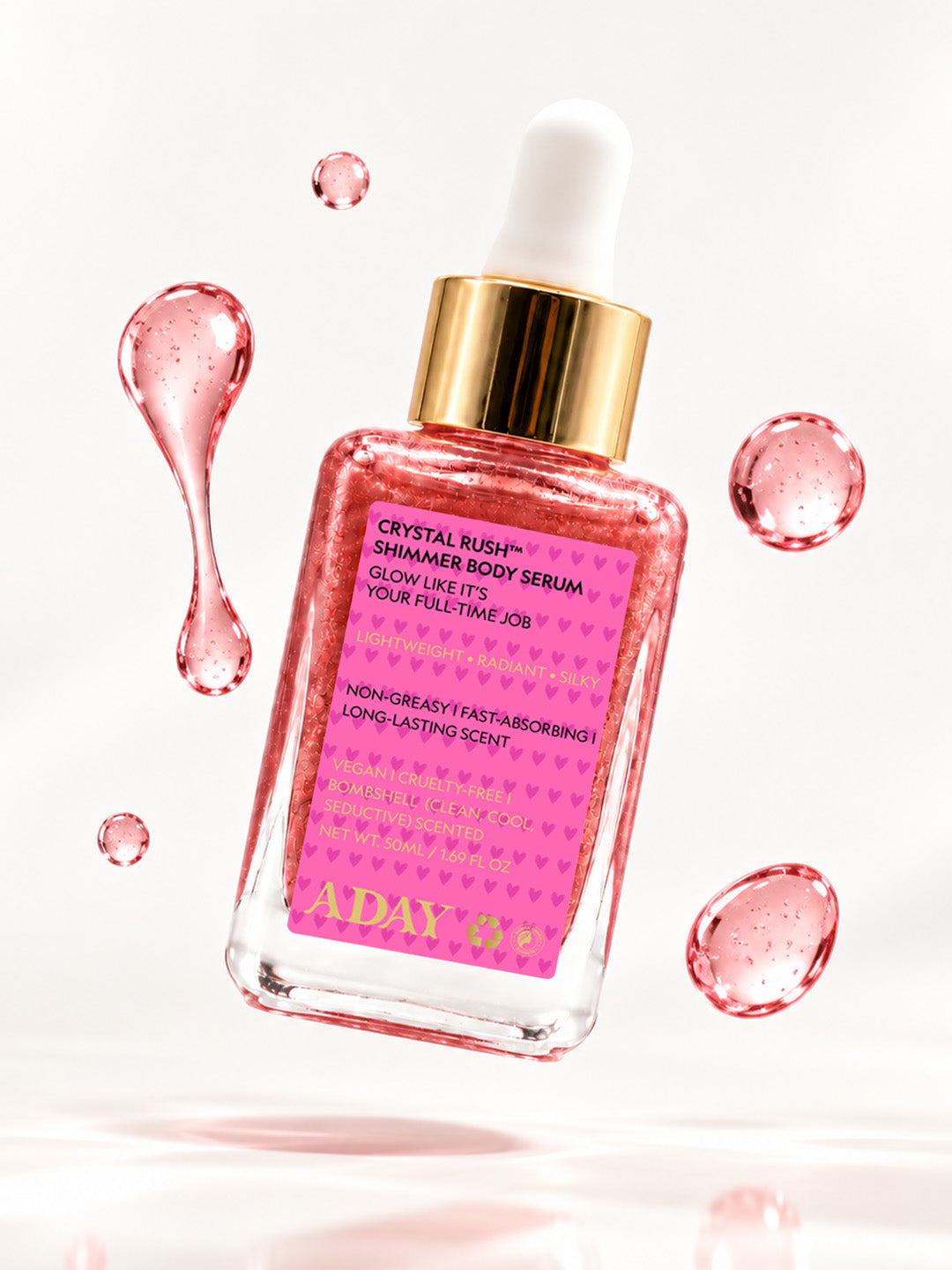 ADAY Crystal Rush Shimmer Body Serum among floating droplets of pink serum