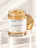 ADAY Glow Frost Sugar Scrub in Candy Cane Rush, a 200 g glass jar with a gold lid on a white pedestal