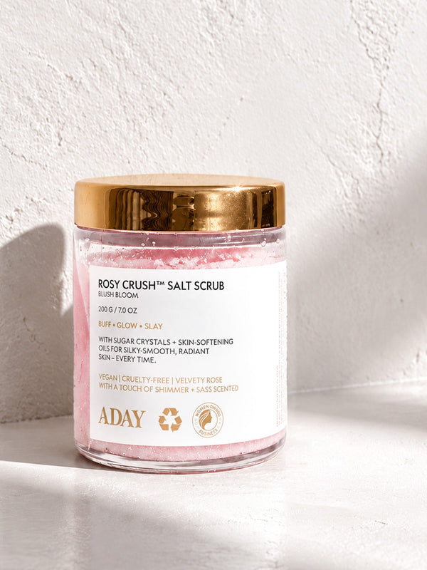 ADAY Rosy Crush Salt Scrub in Blush Bloom, a 200 g glass jar with a gold lid