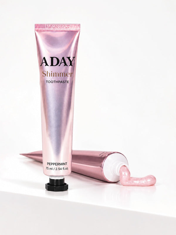 ADAY Shimmer Toothpaste in Pink Peppermint, two 75 ml pearlescent pink tubes with black octagonal caps