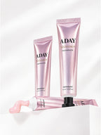 Two tubes of ADAY Pink Shimmer Toothpaste on white plinths, one with a curl of paste