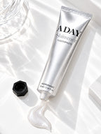 ADAY Silver Shimmer Toothpaste lying open with a curl of paste beside it