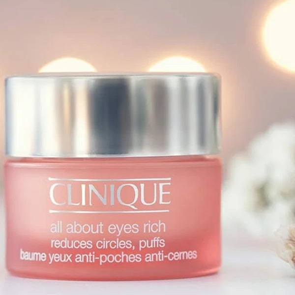 Clinique All About Eyes luxury skincare for all skin types, showing a sleek jar of eye cream with a smooth, elegant design.